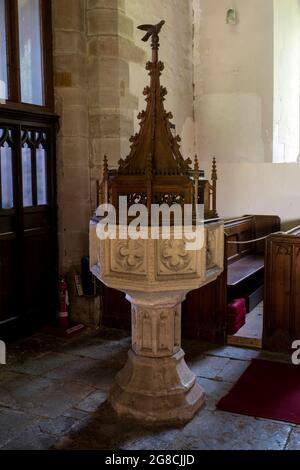 The font in St. Peter and St Paul`s Church, Butlers Marston, Warwickshire, England, UK Stock Photo